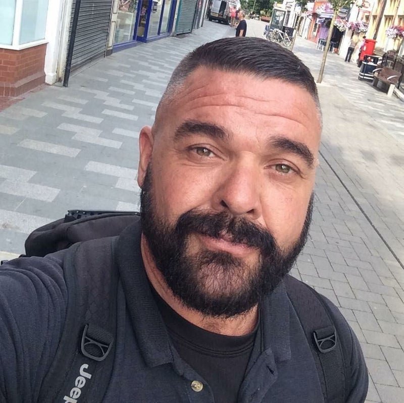 Daniel K. working on a laptop in a home office